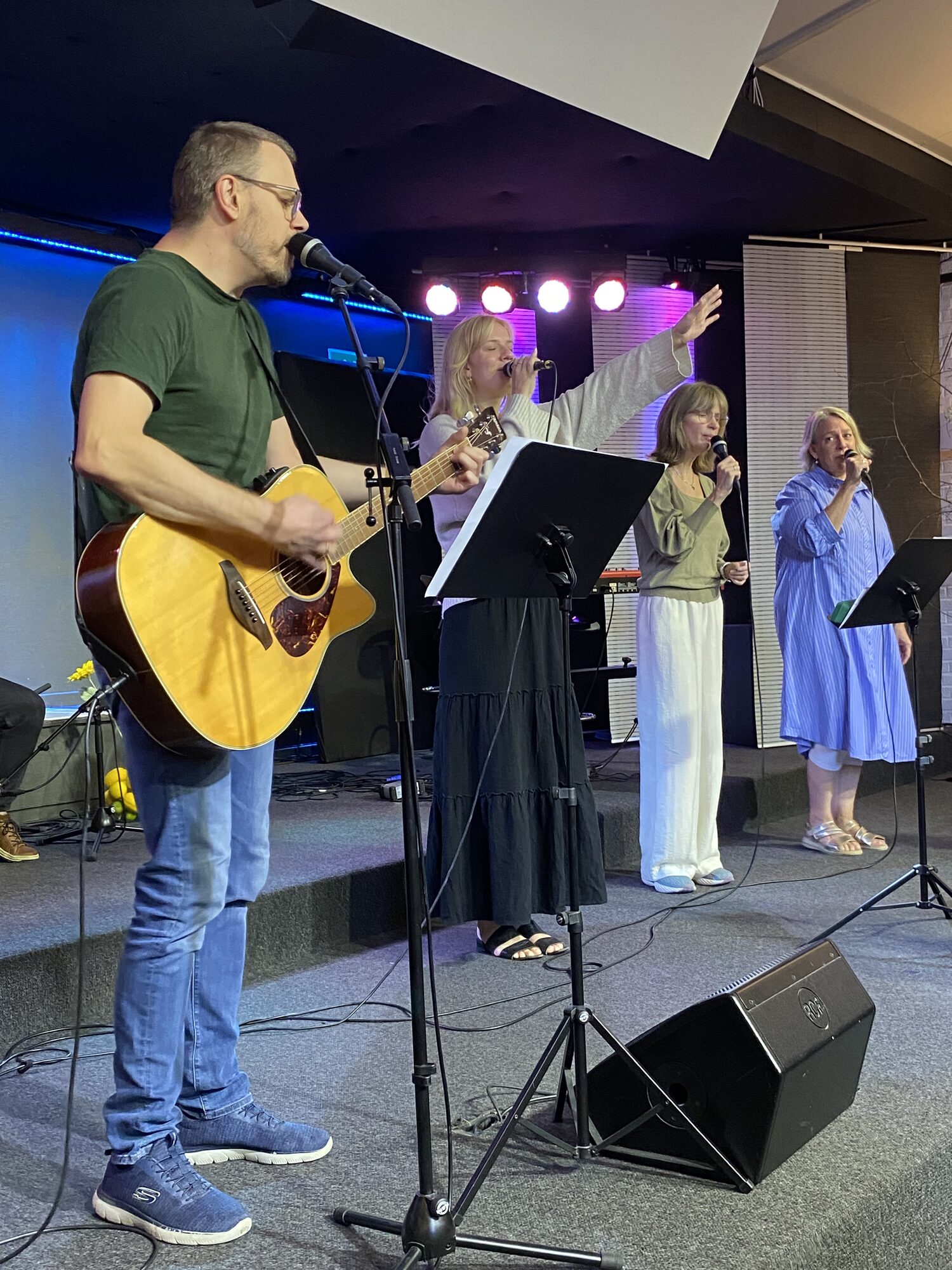 A band with guitar and singers leading worship at Bykirken