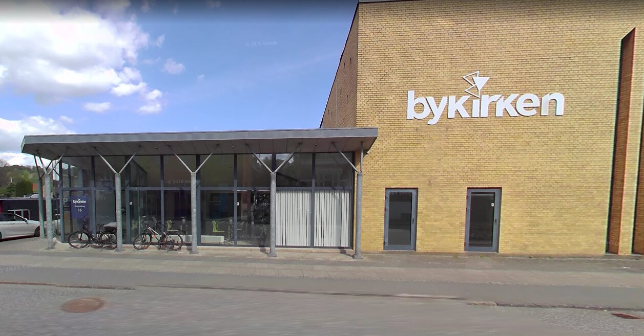 The Bykirken Vejle building with its white Bykirken sign